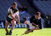15 October 2000; Charlie Carter of Ireland in action against Norman Campbell of Scotland during the Hurling Shinty International match between Ireland and Scotland at Croke Park in Dublin. Photo Ray McManus/Sportsfile