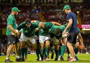 8 August 2015; Ireland front row, from left, Mike Ross, Richardt Strauss and Jack McGrath practice the scrum, watched by scrum coach Greg Feek, left, and forwards coach Simon Easterby. Rugby World Cup Warm-Up Match, Wales v Ireland. Millennium Stadium, Cardiff, Wales. Picture credit: Ramsey Cardy / SPORTSFILE