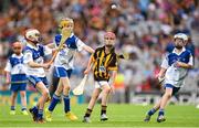 9 August 2015; Charlie Hamilton, St, Joseph’s NS, Dromahair, Leitrim, representing Kilkenny,  in action against Michael Staunton, Naomh Ceitheach SN, Ballymacurley, Roscommon, representing Waterford, Noah Coyne Tyrell, St Mary’s NS, Mullingar, Westmeath, representing Waterford, and Luke Waterhouse, Francis Street CBS, Francis Street, Dublin, representing Waterford, during the Cumann na mBunscol INTO Respect Exhibition Go Games 2015 at Kilkenny v Waterford - GAA Hurling All-Ireland Senior Championship Semi-Final. Croke Park, Dublin. Picture credit: Stephen McCarthy / SPORTSFILE