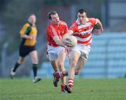 4 January 2009; Paul Flynn, C.I.T, is tackled by Alan O'Connor, Cork. McGrath Cup Preliminary Round, Cork v Cork Institute of Technology, Pairc Ui Rinn, Cork. Picture credit: Brendan Moran / SPORTSFILE