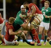 8 August 2015; Michael Bent, Ireland, is tackled by Ross Moriarty, left, and Taulupe Faletau, Wales. Rugby World Cup Warm-Up Match, Wales v Ireland, Millennium Stadium, Cardiff, Wales. Picture credit: Brendan Moran / SPORTSFILE