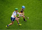 9 August 2015; Ellen Regan, Crinkill NS, Birr, Offaly, representing Waterford, in action against Sophie Bermingham, Rathcoyle NS, Kiltegan, Wicklow, representing Kilkenny, during the Cumann na mBunscol INTO Respect Exhibition Go Games 2015 at Kilkenny v Waterford - GAA Hurling All-Ireland Senior Championship Semi-Final. Croke Park, Dublin. Picture credit: Dáire Brennan / SPORTSFILE