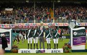 7 August 2015; The Winning Ireland team, from left to right, Greg Patrick Broderick, Darragh Kenny, Chefd'Equipe Robert Splaine, Bertram Allen and Cian O'Connor show the Aga Khan Cup to the home crowd after their victory in the Furusiyya FEI Nations Cup during the Discover Ireland Dublin Horse Show 2015. RDS, Ballsbridge, Dublin.  Picture credit: Cody Glenn / SPORTSFILE