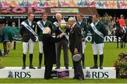 7 August 2015; The President of Ireland Michael D. Higgins, front left, and RDS President Matt Dempsey present the Aga Khan Cup to the winning Ireland team, from left to right, Greg Patrick Broderick, Darragh Kenny, Chefd'Equipe Robert Splaine, Bertram Allen and Cian O'Connor after their victory in the Furusiyya FEI Nations Cup during the Discover Ireland Dublin Horse Show 2015. RDS, Ballsbridge, Dublin.  Picture credit: Cody Glenn / SPORTSFILE