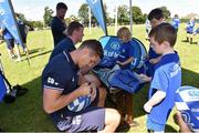 12 August 2015; Leinster's Colm O'Shea signs an autograph during the Bank of Ireland Summer Camp in New Ross RFC, The Grounds, Southknock, New Ross, Co. Wexford. Picture credit: Matt Browne / SPORTSFILE