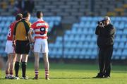 4 January 2009; Team captains Conor McCarthy, left, Cork, and Paul Flynn, CIT and referee Aidan Mangan have their picture taken by local photographer George Hatchell before the game. McGrath Cup Preliminary Round, Cork v Cork Institute of Technology, Pairc Ui Rinn, Cork. Picture credit: Brendan Moran / SPORTSFILE