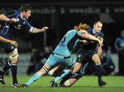 10 January 2009; Chris Whitaker, Leinster, is tackled by Paul Tito, left, and Bradley Davies, Cardiff Blues. Magners League, Leinster v Cardiff Blues, RDS, Dublin. Picture credit: Stephen McCarthy / SPORTSFILE