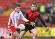 11 January 2009; Peter Donnelly, Tyrone, in action against Michael Magee, Down. Gaelic Life Dr. McKenna Cup, Section B, Round 2, Down v Tyrone, Pairc Esler, Newry, Co Down. Photo by Sportsfile