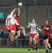 11 January 2009; Kevin Hughes, left, and Colm Doris, Tyrone, in action against Cathal Magee, Down. Gaelic Life Dr. McKenna Cup, Section B, Round 2, Down v Tyrone, Pairc Esler, Newry, Co Down. Photo by Sportsfile