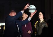 13 January 2009; Captain of the Down All-Ireland football team Joe Lennon catches a signed ball by the team as he is watched on by President Mary McAleese and her aide-de-camp Niamh O'Mahony, who is daughter to Mayo football manager John O'Mahony, during the Down 1968 All-Ireland football team's visit to Áras an Uachtaráin. Áras an Uachtaráin, Phoenix Park, Dublin. Photo by Sportsfile