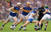 12 July 2015; Colin Dunford, Waterford, in action against Tipperary players, from left, Michael Breen, Padraic Maher and James Woodlock. Munster GAA Hurling Senior Championship Final. Tipperary v Waterford. Semple Stadium, Thurles, Co. Tipperary. Picture credit: Stephen McCarthy / SPORTSFILE