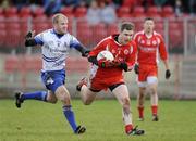 18 January 2009; Enda McGinley, Tyrone, in action against Dick Clerkin, Monaghan. Gaelic Life Dr. McKenna Cup, Section B, Tyrone v Monaghan, Healy Park, Omagh, Co. Tyrone. Picture credit: Oliver McVeigh / SPORTSFILE