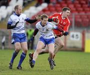 18 January 2009; Enda McGinley, Tyrone, in action against Dick Clerkin and Dermot McArdle, Monaghan. Gaelic Life Dr. McKenna Cup, Section B, Tyrone v Monaghan, Healy Park, Omagh, Co. Tyrone. Picture credit: Oliver McVeigh / SPORTSFILE