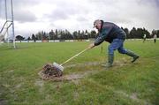 18 January 2009; Steward Hugh Rudden removes the excess water from the pitch before the match. FBD League, Section A, Mayo v Roscommon, Ballyhaunis GAA Club, Ballyhaunis, Co. Mayo. Picture credit: Ray Ryan / SPORTSFILE