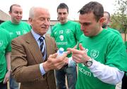 19 January 2009; Republic of Ireland supporter Ger Keville, right, from Dublin, presents Republic of Ireland manager Giovanni Trapattoni with a bottle of holy water after the FAI announced that it will set up a 1,500 seat singing section in the Davin Stand, in Croke Park, commencing with the next World Cup Qualifier against Georgia. FAI Headquarters, Abbotstown, Dublin. Picture credit: David Maher / SPORTSFILE