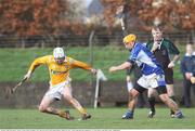 18 January 2009; Karl Stewart, Antrim, in action against Joe Phelan, Laois, under the watch of referee Dickie Murphy. Walsh Cup, Laois v Antrim, Kelly Daly Park, Rathdowney, Co. Laois. Picture credit: Brian Lawless / SPORTSFILE