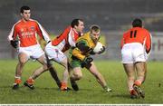 21 January 2009; Conall Dunne, Donegal, in action against Tony McClelland, Martin O'Rourke, and Brian Mallon, Armagh. Gaelic Life Dr. McKenna Cup Semi-Final, Donegal v Armagh, Healy Park, Omagh, Co. Tyrone. Picture credit: Oliver McVeigh / SPORTSFILE
