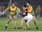 21 January 2009; Martin O'Rourke, Armagh, in action against Neil McGee and Rory Kavanagh, Donegal. Gaelic Life Dr. McKenna Cup Semi-Final, Donegal v Armagh, Healy Park, Omagh, Co. Tyrone. Picture credit: Oliver McVeigh / SPORTSFILE