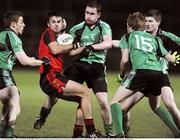 22 January 2009; Hugh Davey, Down, in action against Ryan Dillon, Charlie Vernon, Luke Howard and Conor Bayne, Queens. Gaelic Life Dr. McKenna Cup Semi-Final, Queens v Down, Pairc Esler, Newry, Co. Down. Picture credit: Oliver McVeigh / SPORTSFILE