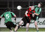 22 January 2009; Michael Magee, Down, in action against Joe O'Kane and Ryan Dillon, Queens. Gaelic Life Dr. McKenna Cup Semi-Final, Queens v Down, Pairc Esler, Newry, Co. Down. Picture credit: Oliver McVeigh / SPORTSFILE