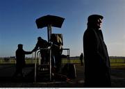 23 January 2009; A punter places a bet ahead of the Normans Grove Steeplechase. Fairyhouse Racecourse, Ratoath, Co. Meath. Picture credit: Brian Lawless / SPORTSFILE