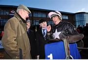 23 January 2009; Jockey Davy Russell speaks with trainer Arthur Moore, left, and representing the owner, Leo Mooney, second from left, and Raymond Mulholland, after winning the Normans Grove Steeplechase aboard Mansony. Fairyhouse Racecourse, Ratoath, Co. Meath. Picture credit: Brian Lawless / SPORTSFILE