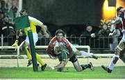 23 January 2009; Fionn Carr, Connacht, goes over to score his side's first try despite the challange of Jean Bapiste Pezet, Dax. European Challenge Cup, Pool 1, Round 6, Connacht v Dax, Sportsground, Galway. Picture credit: David Maher / SPORTSFILE