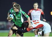 23 January 2009; Ian Keatley, Connacht, is tackled by, David Bortolussi, Dax. European Challenge Cup, Pool 1, Round 6, Connacht v Dax, Sportsground, Galway. Picture credit: David Maher / SPORTSFILE