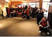 24 January 2009; Munster supporters wait in the lobby of the Novotel, for news from the pitch inspection, before it was announced that the game was postponed untill 2pm tomorrow Sunday the 25th. Heineken Cup, Pool 1, Round 6, Montauban v Munster, Parc de Sapiac, Montauban, France. Picture credit: Matt Browne / SPORTSFILE