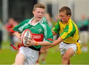 16 August 2015; Dylan Doyle ,Hacketstown, Co. Carlow, is tackled by Patrick Dolphin ,Creora/Patrickswell, Co. Limerick, during the Mixed U14 and O11 Tag Rugby. HSE National Community Games Festival, Weekend 1. Athlone IT, Athlone, Co. Westmeath. Picture credit: Seb Daly / SPORTSFILE