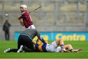 16 August 2015; Andrew Smith, Galway, scores a point as James Woodlock, Tipperary, is treated for an injury. GAA Hurling All-Ireland Senior Championship, Semi-Final, Tipperary v Galway. Croke Park, Dublin. Picture credit: Piaras Ó Mídheach / SPORTSFILE