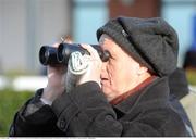 24 January 2009; A race fan keeps a close eye on the Navan Golf Club Open For Membership Hurdle. Navan Racecourse, Proudstown, Navan. Picture credit: Pat Murphy / SPORTSFILE