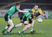 24 January 2009; Neil Gallagher, Donegal, in action against Charlie Vernon and Conor Maginn, Queens. Gaelic Life Dr. McKenna Cup Final, Donegal v Queens. Healy Park, Omagh, Co. Tyrone. Picture credit: Oliver McVeigh / SPORTSFILE