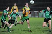 24 January 2009; Neil Gallagher, Donegal, in action against James Loughrey, Ryan Dillon and Paul Courtney, Queens. Gaelic Life Dr. McKenna Cup Final, Donegal v Queens. Healy Park, Omagh, Co. Tyrone. Picture credit: Oliver McVeigh / SPORTSFILE