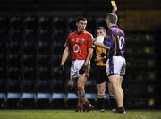 24 January 2009; Cork's Paddy Kelly is shown the yellow card by referee Derek O'Mahony. McGrath Cup Football Final, Cork v University of Limerick. Pairc Ui Rinn, Cork. Picture credit: Brian Lawless / SPORTSFILE