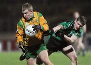 24 January 2009; Conall Dunne, Donegal, in action against Conor Maginn, Queens. Gaelic Life Dr. McKenna Cup Final, Donegal v Queens. Healy Park, Omagh, Co. Tyrone. Picture credit: Oliver McVeigh / SPORTSFILE