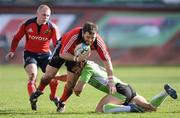 25 January 2009; Marcus Horan, Munster, is tackled by Shanon Paku, Montauban. Heineken Cup, Pool 1, Round 6, Montauban v Munster, Parc de Sapiac, Montauban, France. Picture credit: Matt Browne / SPORTSFILE