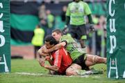 25 January 2009; Munster's Lifeimi Mafi goes over for his second try despite the tackle of Montauban's Yannick Caballero. Heineken Cup, Pool 1, Round 6, Montauban v Munster, Parc de Sapiac, Montauban, France. Picture credit: Matt Browne / SPORTSFILE