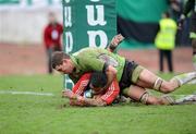 25 January 2009; Munster's Lifeimi Mafi goes over for his second try despite the tackle of Montauban's Yannick Caballero. Heineken Cup, Pool 1, Round 6, Montauban v Munster, Parc de Sapiac, Montauban, France. Picture credit: Matt Browne / SPORTSFILE