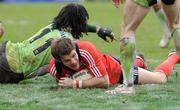 25 January 2009; Barry Murphy, Munster, dives over to score his side's fourth try despite the attempts of Montauban's Vilimoni Delasau. Heineken Cup, Pool 1, Round 6, Montauban v Munster, Parc de Sapiac, Montauban, France. Picture credit: Matt Browne / SPORTSFILE