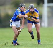 25 January 2009; Brendan Bugler, Clare, in action against James Woodlock, Tipperary. Waterford Crystal Cup Hurling Final, Clare v Tipperary, Ogonnolloe, Co. Clare. Picture credit: Pat Murphy / SPORTSFILE