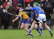 25 January 2009; Niall Gilligan, Clare, in action against Declan Fanning, Tipperary. Waterford Crystal Cup Hurling Final, Clare v Tipperary, Ogonnolloe, Co. Clare. Picture credit: Pat Murphy / SPORTSFILE
