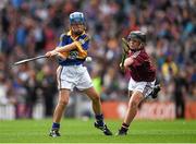 16 August 2015; Tom Mathews, Scoil Bhríde, Dunleer, Louth, representing Tipperary, in action against Colm Sheehan, Laragh NS, Bandon, Cork, representing Galway, during the Cumann na mBunscol INTO Respect Exhibition Go Games 2015 at Tipperary v Galway - GAA Hurling All-Ireland Senior Championship Semi-Final. Croke Park, Dublin. Picture credit: Ray McManus / SPORTSFILE