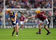 16 August 2015; Dara McGonigle, St. Canice’s PS, Dungiven, Derry, representing Tipperary, in action against Andrew Kelly, Ballintotas NS, Castlemartyr, Cork, representing Galway, during the Cumann na mBunscol INTO Respect Exhibition Go Games 2015 at Tipperary v Galway - GAA Hurling All-Ireland Senior Championship Semi-Final. Croke Park, Dublin. Picture credit: Ray McManus / SPORTSFILE