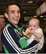 16 August 2015; Ireland's gold medal winner Michael Conlan, Bantam weight, with his daughter Luisne, age 5 months, at the Ireland team's homecoming from the EUBC Elite European Boxing Championships. Dublin Airport, Dublin. Picture credit: Cody Glenn / SPORTSFILE