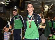 16 August 2015; Ireland's gold medal winners Michael Conlan, right, Bantam weight, with his Best Boxer trophy, and team-mate Joe Ward, 81kg light heavy weight, with son Joel, age 3, at the Ireland team's homecoming from the EUBC Elite European Boxing Championships. Dublin Airport, Dublin. Picture credit: Cody Glenn / SPORTSFILE