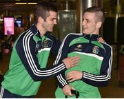 16 August 2015; Ireland team-mates Adam Nolan, welter weight, left, shares a laugh with Dean Walsh, welter weight bronze medal winner, at the Ireland team's homecoming from the EUBC Elite European Boxing Championships. Dublin Airport, Dublin. Picture credit: Cody Glenn / SPORTSFILE