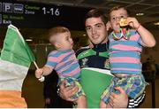 16 August 2015; Ireland's gold medal winner Joe Ward, 81kg light heavy weight, celebrates with his boys Jerry Ward, age 1, left, and Joel Ward, age 3, at the Ireland team's homecoming from the EUBC Elite European Boxing Championships. Dublin Airport, Dublin. Picture credit: Cody Glenn / SPORTSFILE