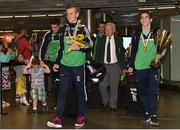 16 August 2015; Ireland's medal winners Dean Walsh, bronze medal welter weight, centre, Joe Ward, gold medal 81kg light heavy weight, left, and Michael Conlan, gold medal and Best Boxer award Bantam weight, right, at the Ireland team's homecoming from the EUBC Elite European Boxing Championships. Dublin Airport, Dublin. Picture credit: Cody Glenn / SPORTSFILE