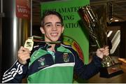 16 August 2015; Ireland's gold medal winner Michael Conlan, Bantam weight, hoists his Best Boxer trophy at the Ireland team's homecoming from the EUBC Elite European Boxing Championships. Dublin Airport, Dublin. Picture credit: Cody Glenn / SPORTSFILE